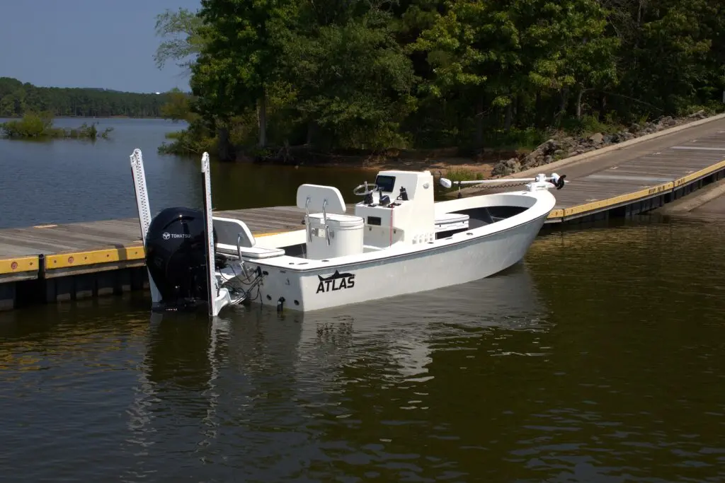 Atlas Boatworks 23F bay boat docked at a dock