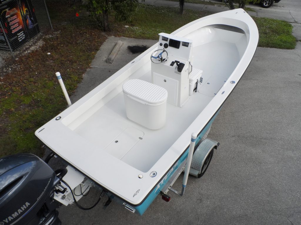 Rear overhead view of an Atlas Boatworks 23F center console fishing boat. Open deck and hatches are seen.