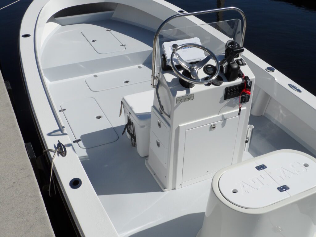 A deck view of an Atlas Boatworks 23F center console fishing boat tied to a dock. Livewell, console, and deck layout are shown.