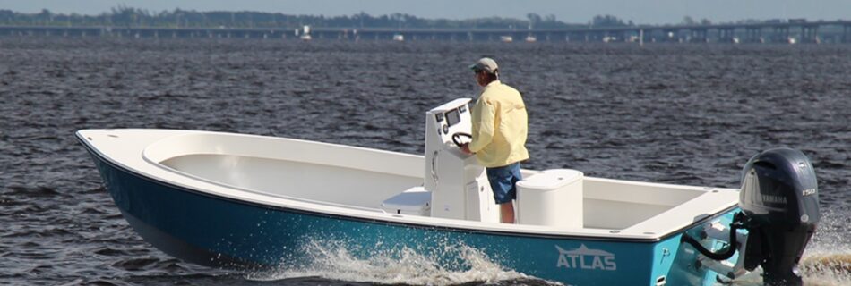 Atlas Boatworks 23F in Boston Whaler blue running at speed. Yamaha 150hp engine on the back.