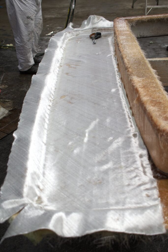 Fiberglass cloth is laid on the back deck
