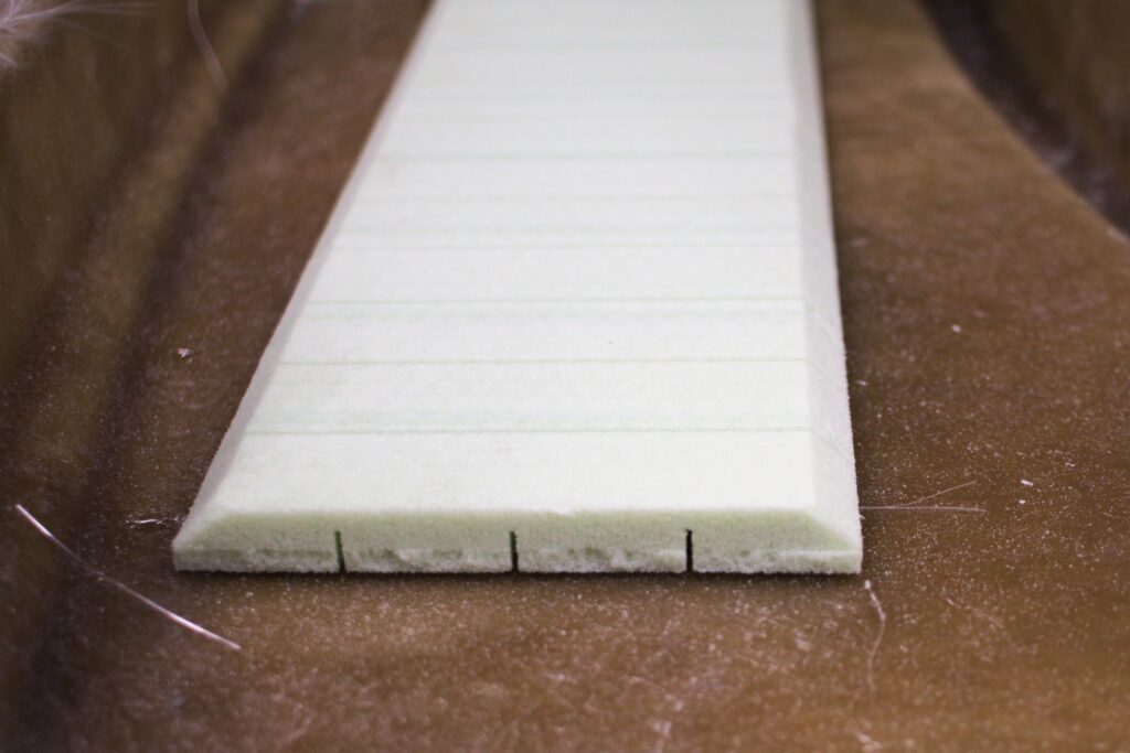 A piece of foam core with beveled edges