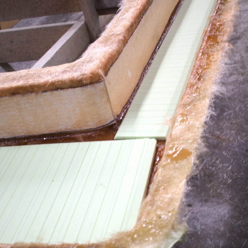 Foam core sits in the deck cap of the Atlas Boatworks Demo Boat waiting for a layer of fiberglass on top