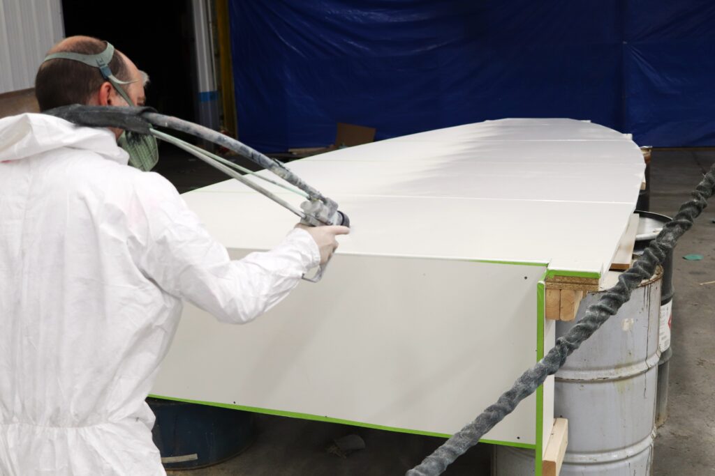 A boat deck mold gets a layer of gelcoat