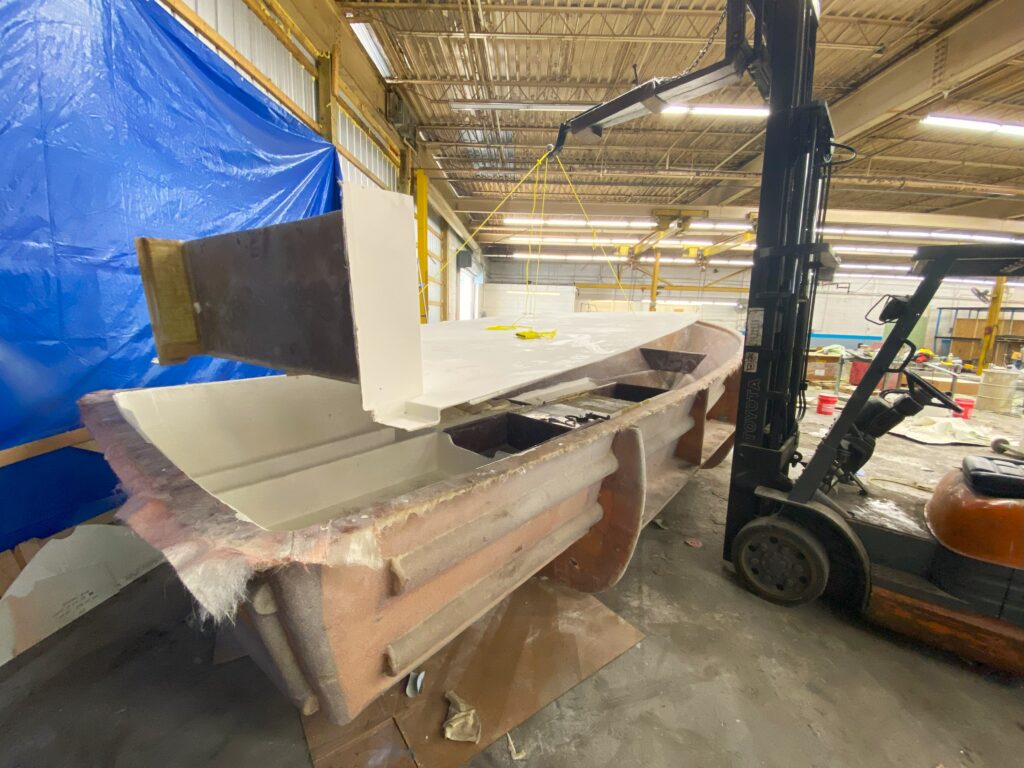 The deck on a boat is fit into the mold