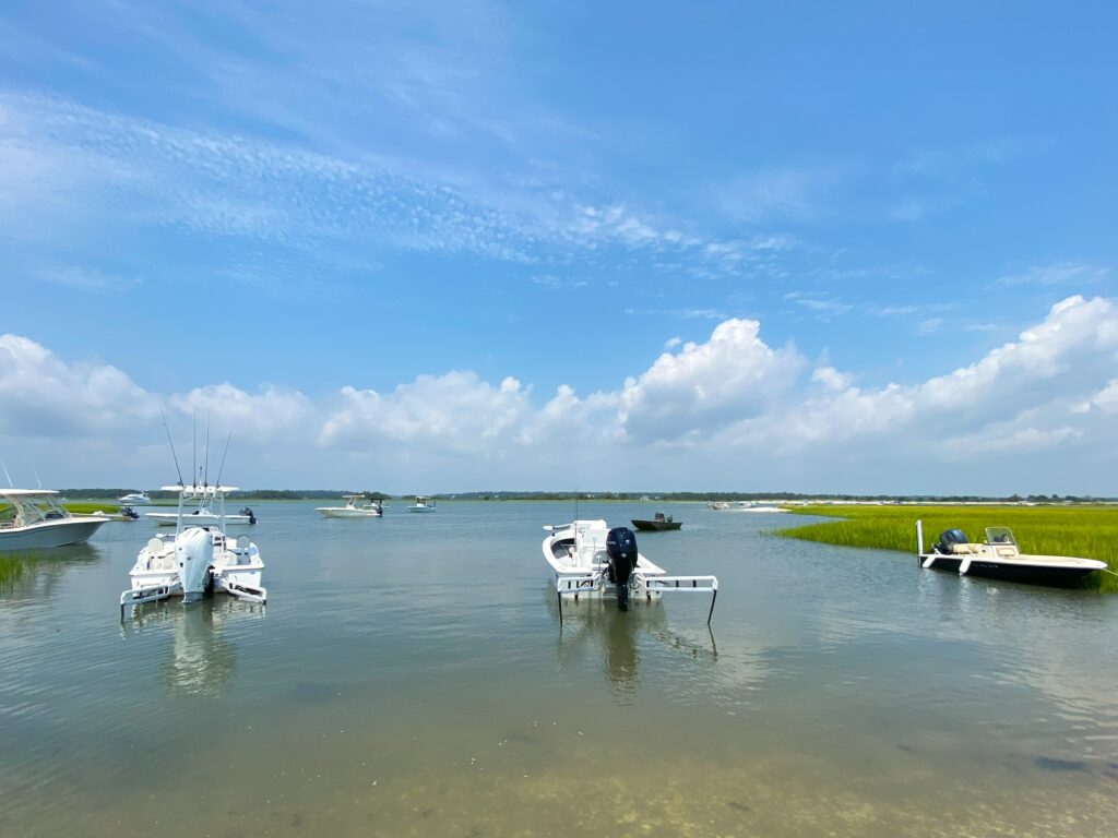 Atlas Boatworks 23F sits anchored in a cove with other boats