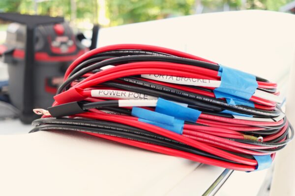 Wires coiled on the deck of an Atlas Boatworks 23F bay boat during the rigging process