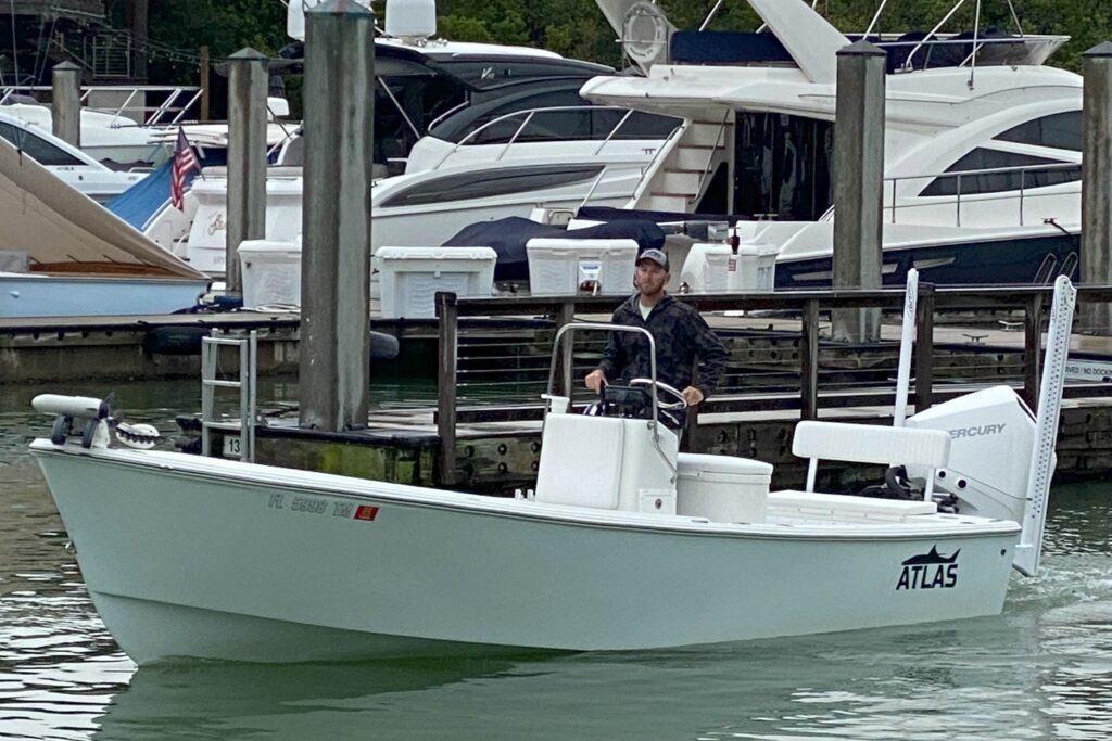 Captain Ben Geroy pilots his Atlas Boatworks 23F bay bot to the dock